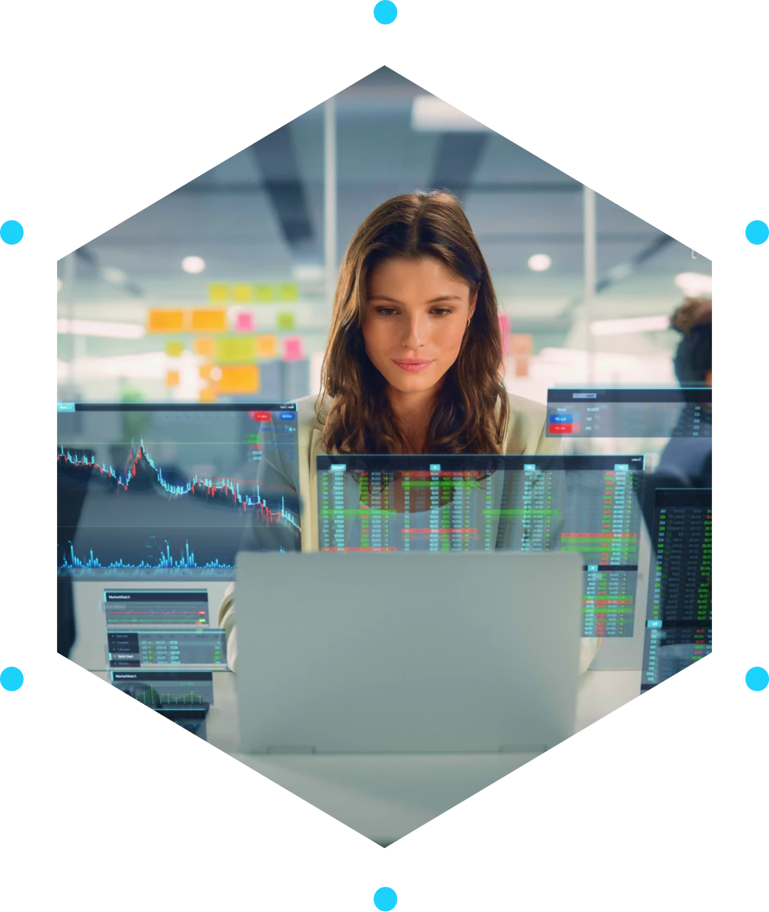 Woman analyzing data on multiple screens